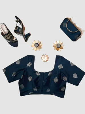 Silk cotton / Banarasi-style silk blend with silver zari-inspired butta motifs.